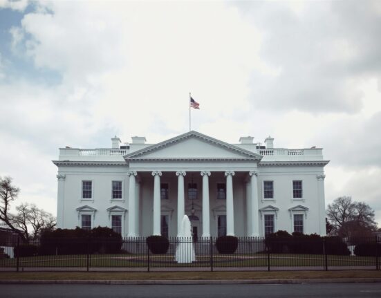 White House exterior on a cloudy day, representing Trump administration policy on ground troops