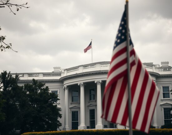 White House exterior on a cloudy day with US flag visible