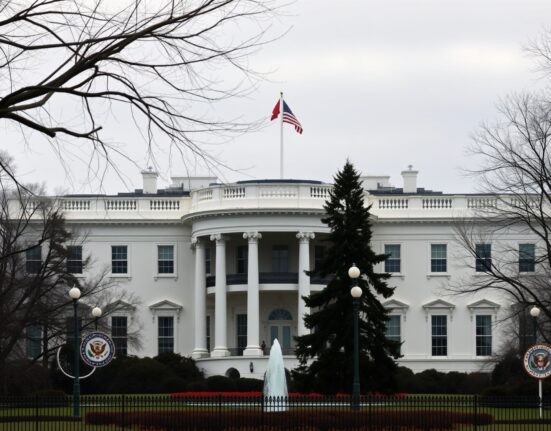 White House in Washington D.C. on a clear day, representing U.S. foreign policy on Iran's nuclear program.