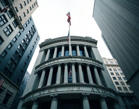 New York Stock Exchange building on Wall Street under overcast sky