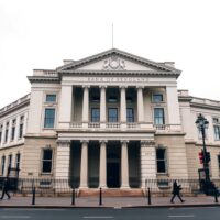 Bank of England building in London on a cloudy day, representing UK monetary policy and inflation analysis.