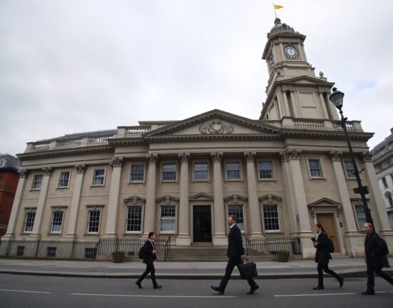 Bank of England building on a cloudy day in London, representing UK economic policy and inflation data.