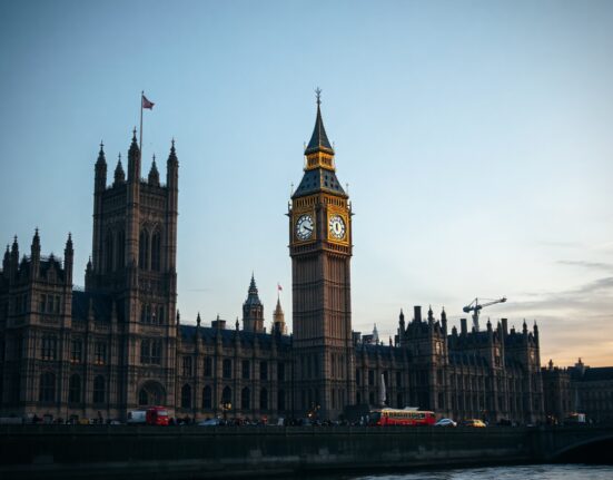 UK Houses of Parliament at dusk with Big Ben in center, symbolizing new political funding laws.