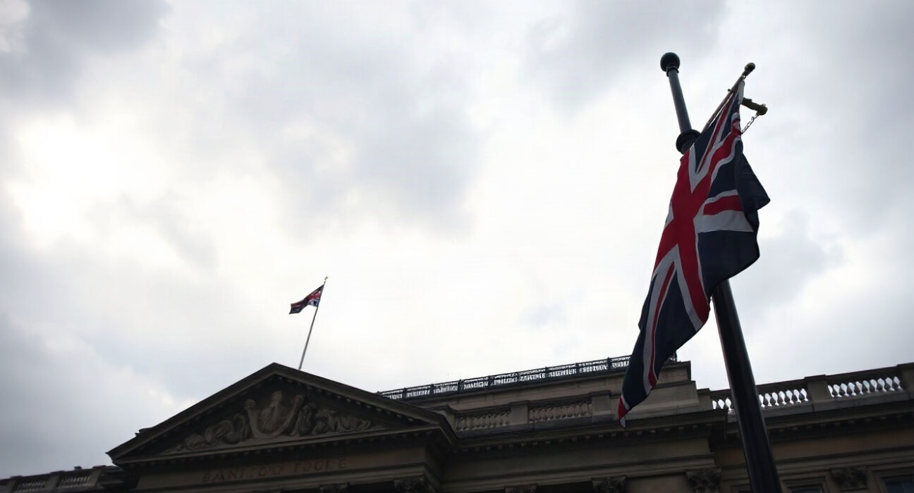 Bank of England building in London on a cloudy day, symbolizing UK economic uncertainty.