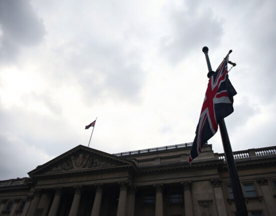 Bank of England building in London on a cloudy day, symbolizing UK economic uncertainty.