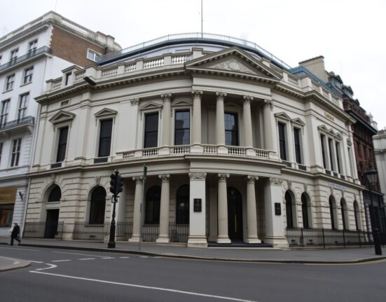 Bank of England building in London on an overcast day, representing UK economic data.