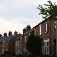 Rows of UK terraced houses under a cloudy sky, representing the housing market in June