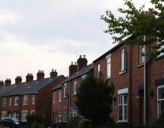 Rows of UK terraced houses under a cloudy sky, representing the housing market in June