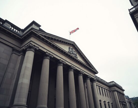 Bank of England building exterior on a cloudy day, representing UK monetary policy.