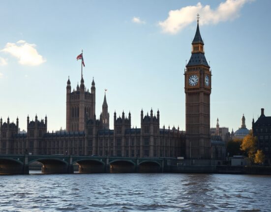 The UK Parliament building in London, with Big Ben, on a clear autumn day.