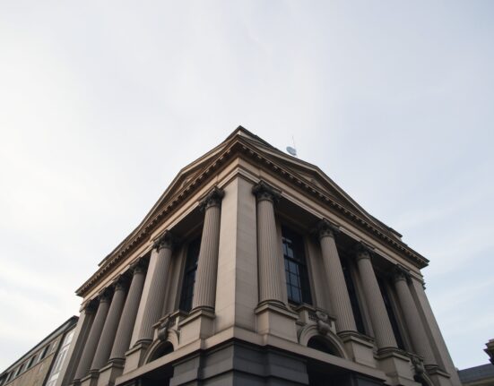 Bank of England building in London under overcast sky, representing UK monetary policy and economic data.