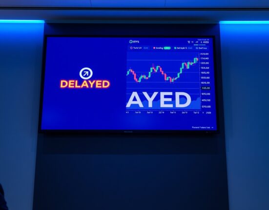 Digital display screen showing a delayed listing notification for IRYS token on a cryptocurrency exchange.