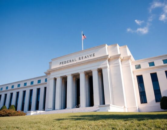Exterior of the Federal Reserve building in Washington, D.C., under a clear sky.