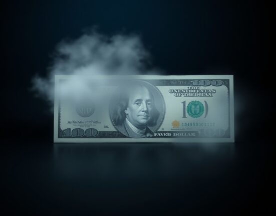 US dollar banknote partially obscured by haze representing uncertain outlook from Fed policy.