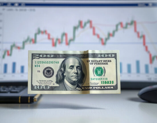 US dollar banknote with shadowy financial chart background, symbolizing debt-market pressure on the currency.