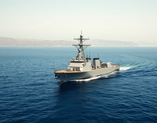 US Navy warship enforces military blockade of Iranian ports in the Strait of Hormuz.