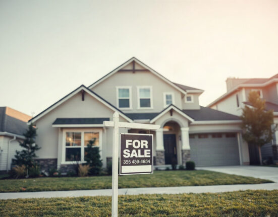 For sale sign in front of a house, representing the US housing market slowdown in July.