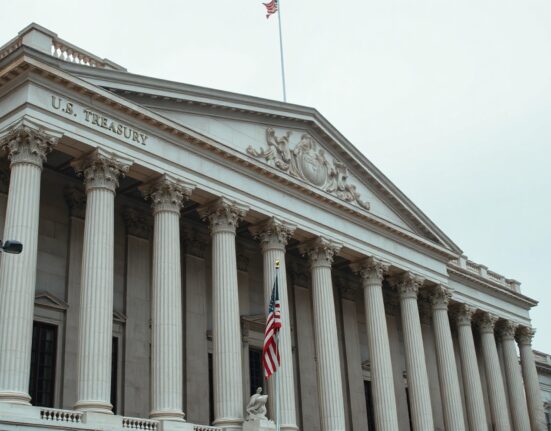 U.S. Treasury building exterior on an overcast day, representing bond market stability amid geopolitical uncertainty.