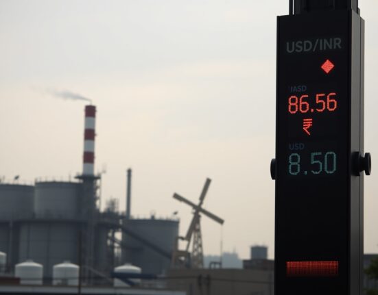 USD/INR exchange rate board showing rupee depreciation against rising crude oil prices in Mumbai