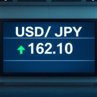 Forex trading board showing USD/JPY exchange rate at 162.10 with breakout above 162.00