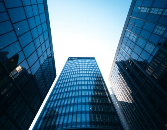 Exterior of a modern financial building representing Virtus Investment headquarters.