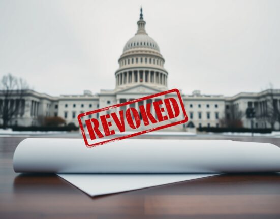 US Capitol building with a revoked document stamp in foreground symbolizing the Iran oil waiver reversal.