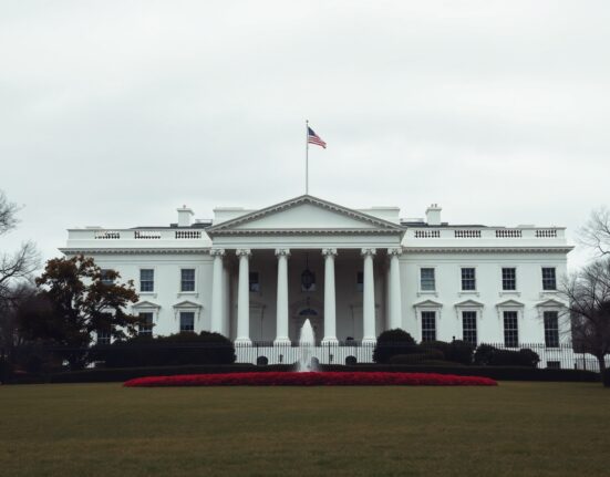 The White House building in Washington D.C. under overcast skies.