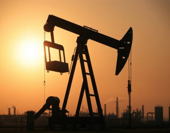 Crude oil pumpjack silhouetted at sunset near refinery, representing WTI price and supply dynamics.