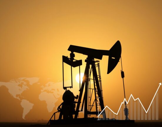 Oil pumpjack silhouetted against sunset sky with chart overlay representing WTI price pressure