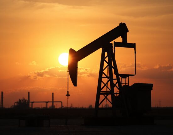 Oil pump jack at sunset, representing WTI crude supply and geopolitical risks