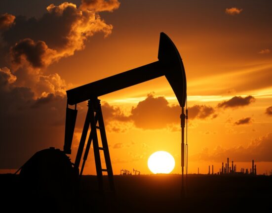 Oil pumpjack silhouette at sunset with storm clouds symbolizing geopolitical tension and surging crude prices