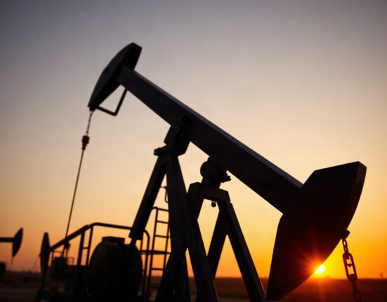 Oil pump jack silhouetted at sunset, symbolizing WTI crude supply concerns.
