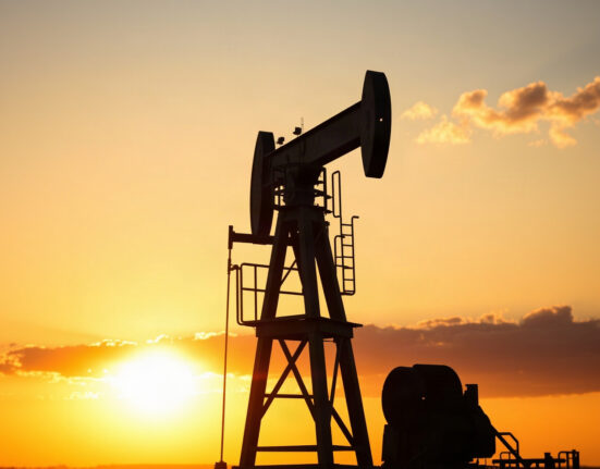 Oil pumpjack silhouetted against sunset, representing WTI crude price rise amid US-Iran tensions
