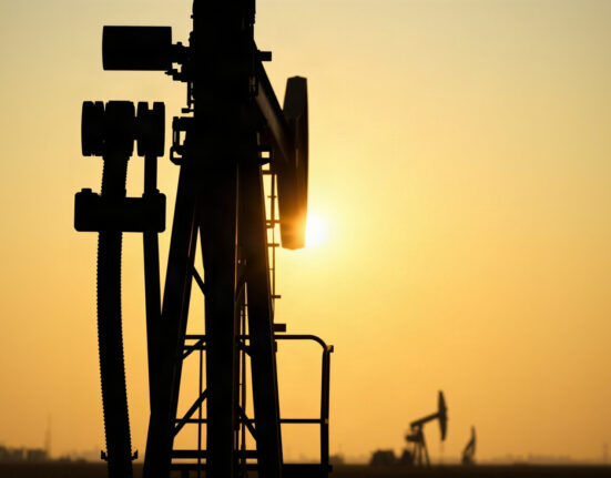 Oil pumpjack silhouette at sunset, representing crude oil supply and market dynamics.