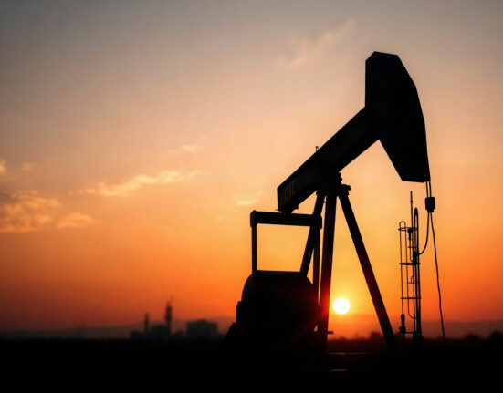 Oil pumpjack silhouette at sunset representing crude oil supply and geopolitical risks