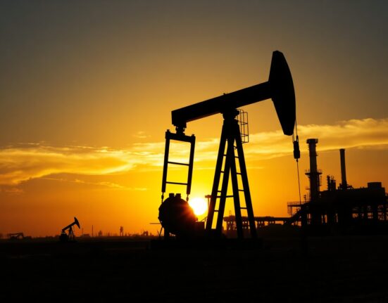Oil pumpjack silhouette at sunset, representing WTI crude supply concerns amid US-Iran tensions.