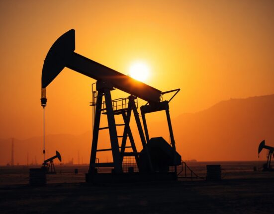 Oil pumpjack silhouette at sunset representing energy supply risk from Middle East tensions