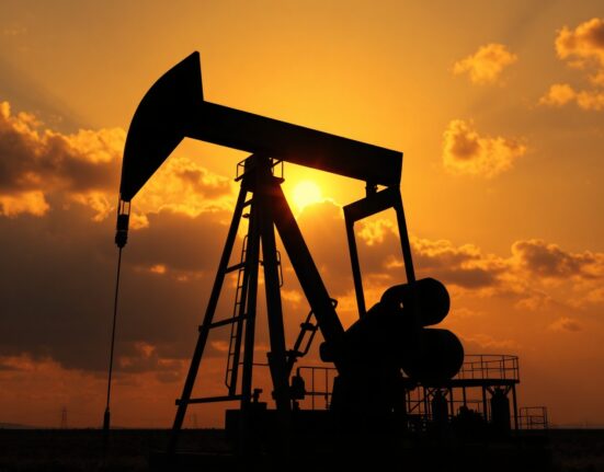 Oil pumpjack silhouetted at sunset with a map of the Strait of Hormuz in the background, representing geopolitical oil supply risks.