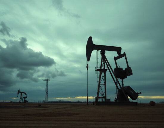 Oil pumpjack silhouetted against an overcast sky, representing WTI crude oil price analysis.