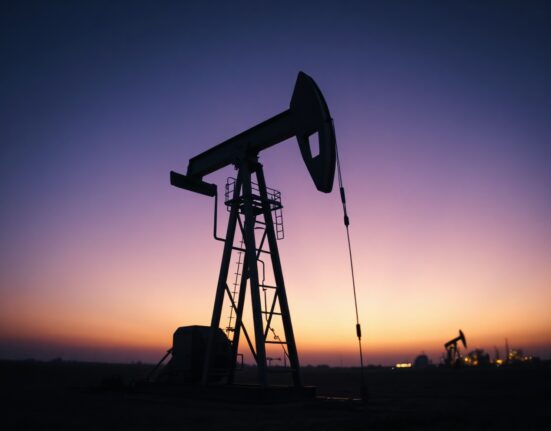 Oil pumpjack silhouette at dusk representing WTI crude oil market recovery