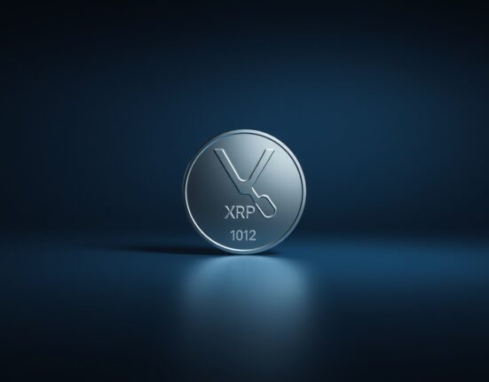 Close-up of a metallic XRP token on a dark, grid-like background, representing cryptocurrency market analysis.